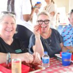 People enjoying a crawfish meal together.