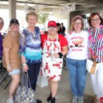 Group of women smiling at an event.