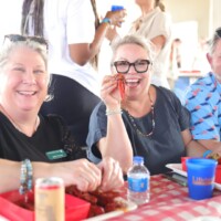 People enjoying a crawfish meal together.