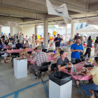 People at a lively indoor community event.
