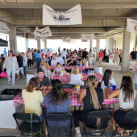 People enjoying a gathering with food indoors.