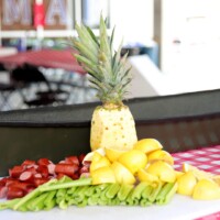 Chopped fruits and vegetables on table.