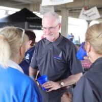 Group of people talking at an event.