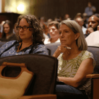 Audience attentively listening during a conference.