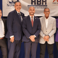 Group of people posing at an event.