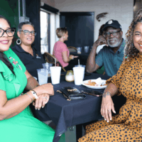 Group of people enjoying a meal together.