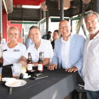 Group of five people at outdoor event.